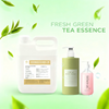 Premium Green Tea Fragrance Oil bottle for soap and candle making on a wooden background.