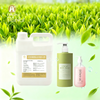 Premium Green Tea Fragrance Oil bottle for soap and candle making on a wooden background.